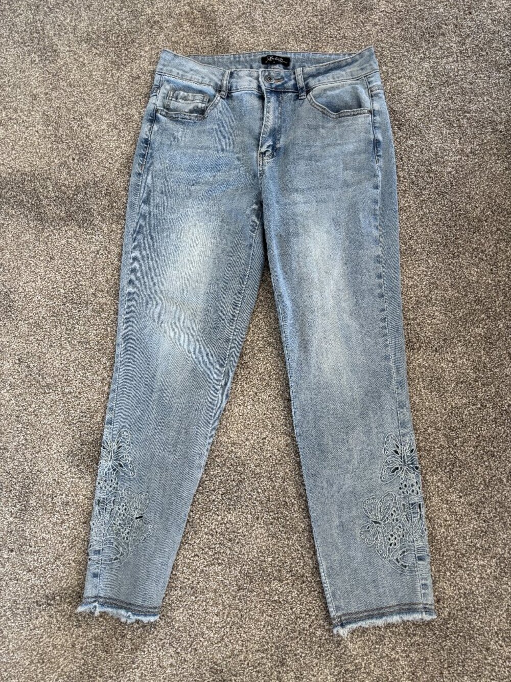 Charlie B Jeans in  Light Wash Denim with Open Design on legs and Frayed Bottom